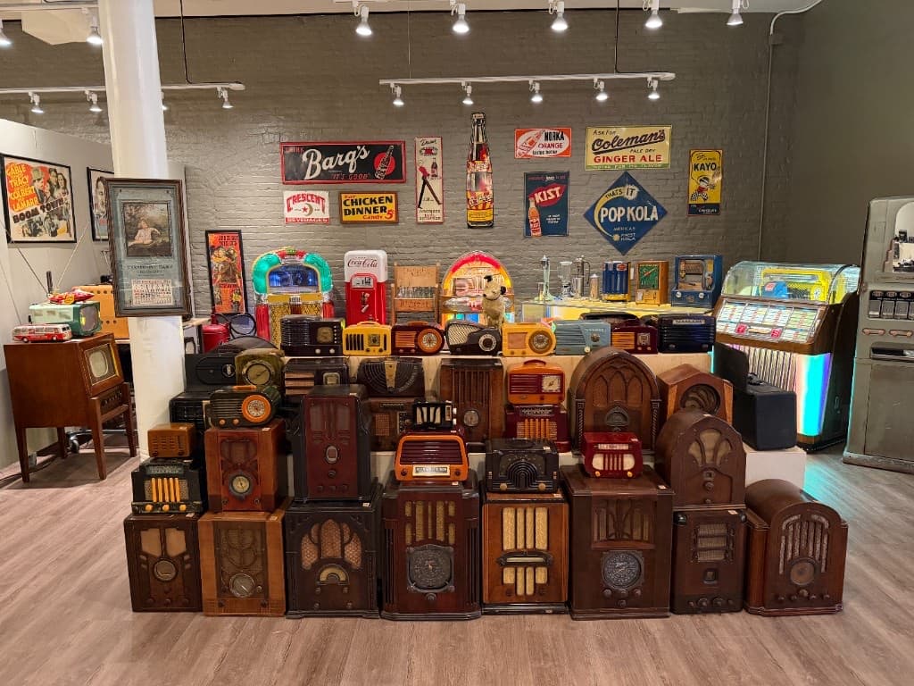 A wall of antique radios in the Beautiful Things galleries